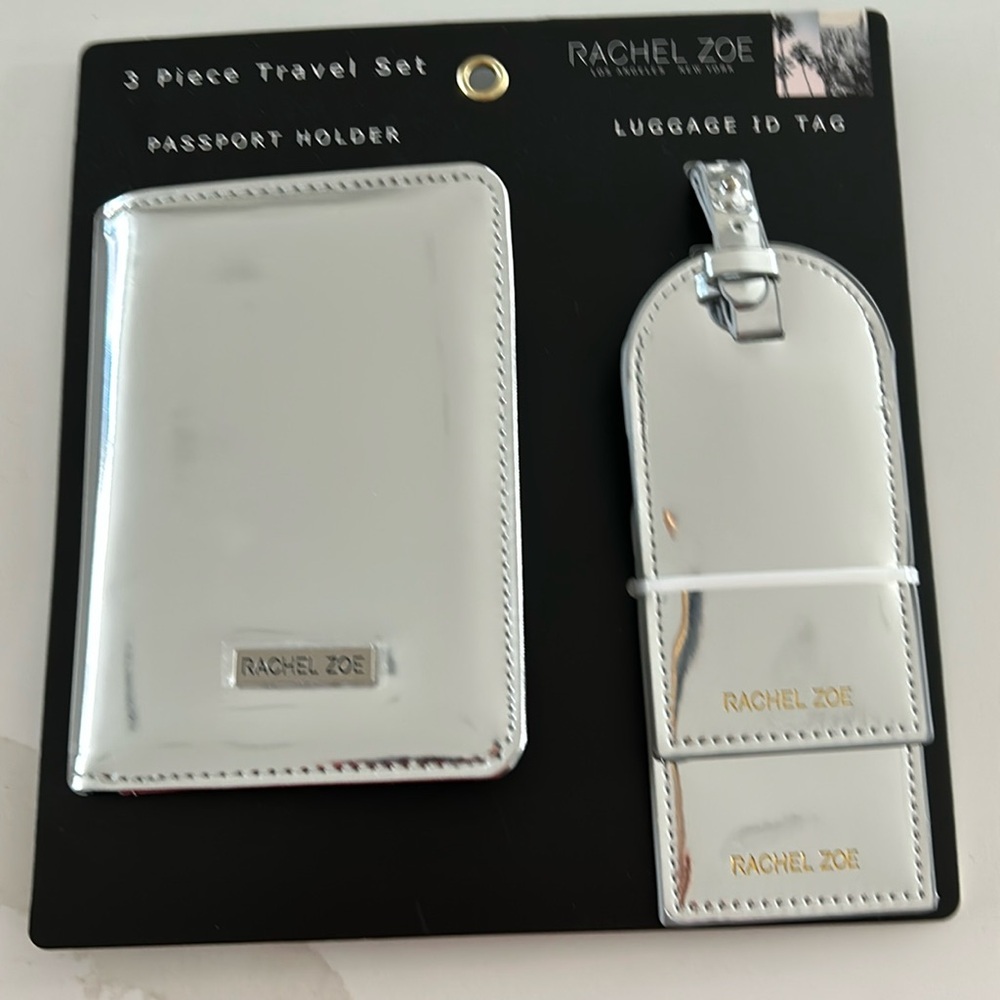 Rachel Zoe 3 piece travel set.  New in package.  Metallic silver patent.